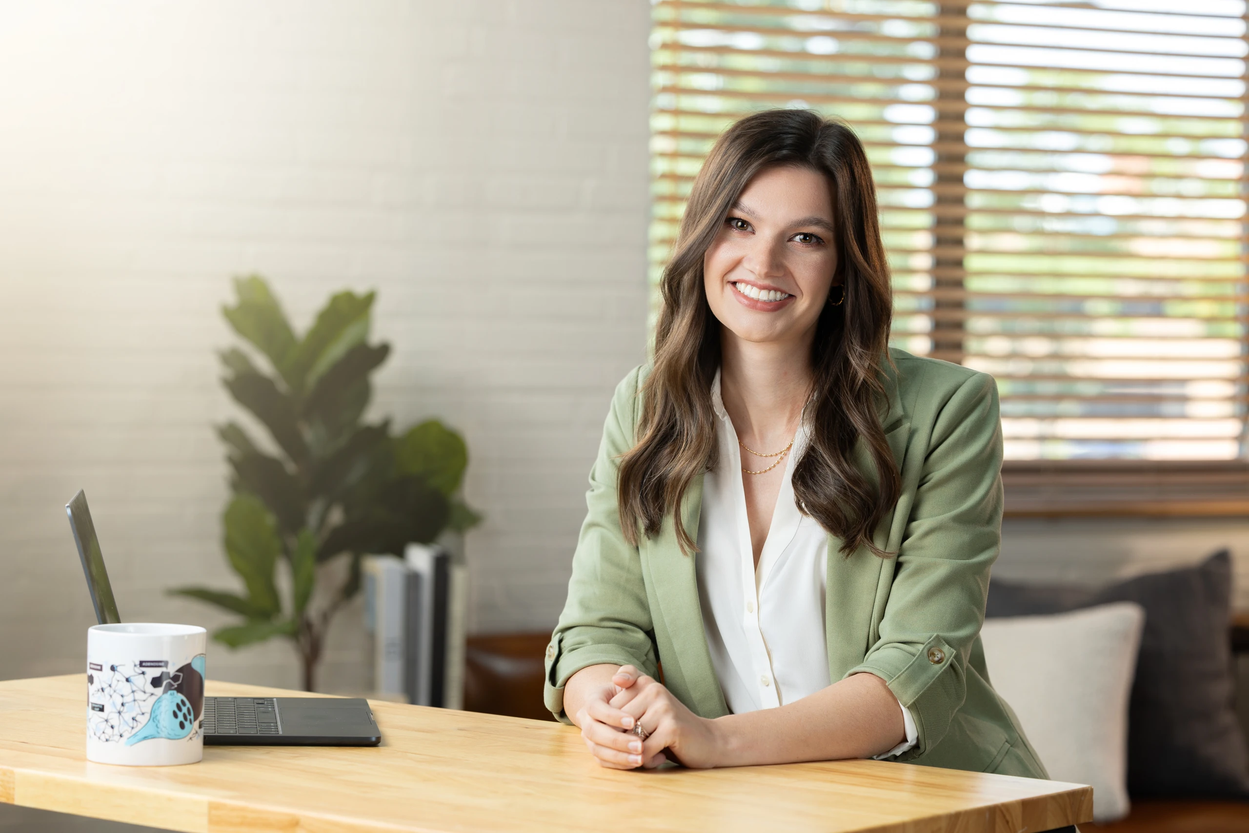 Dr. Rachel Korest seated at her desk in a warm, professional office